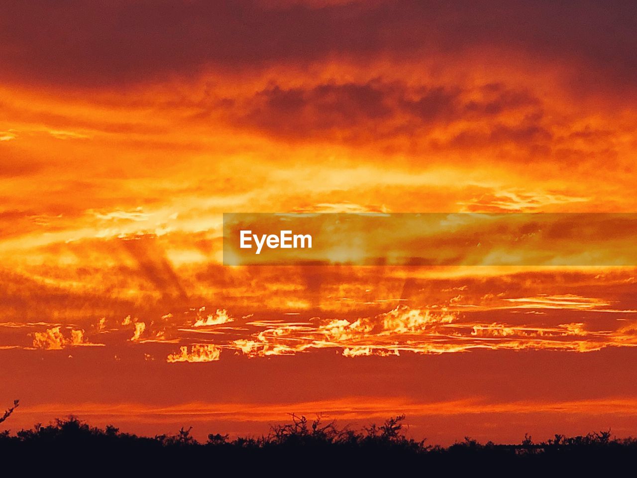 SCENIC VIEW OF DRAMATIC SKY DURING SUNSET