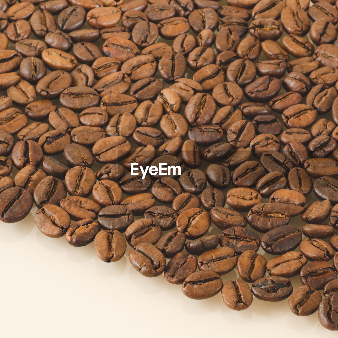 HIGH ANGLE VIEW OF COFFEE BEANS ON FLOOR