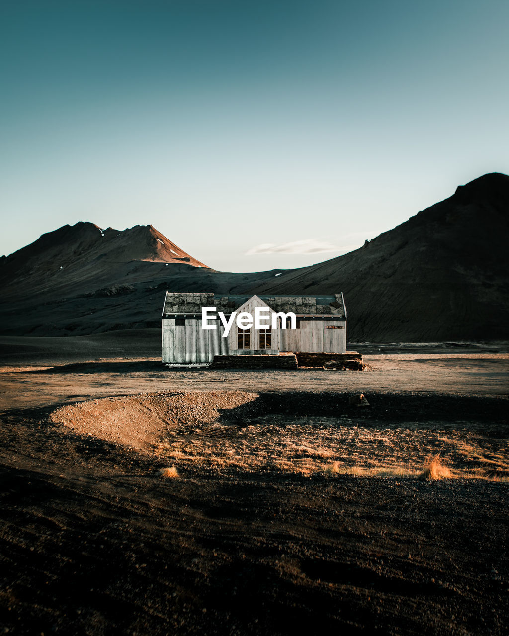 Scenic view of house against clear sky in iceland