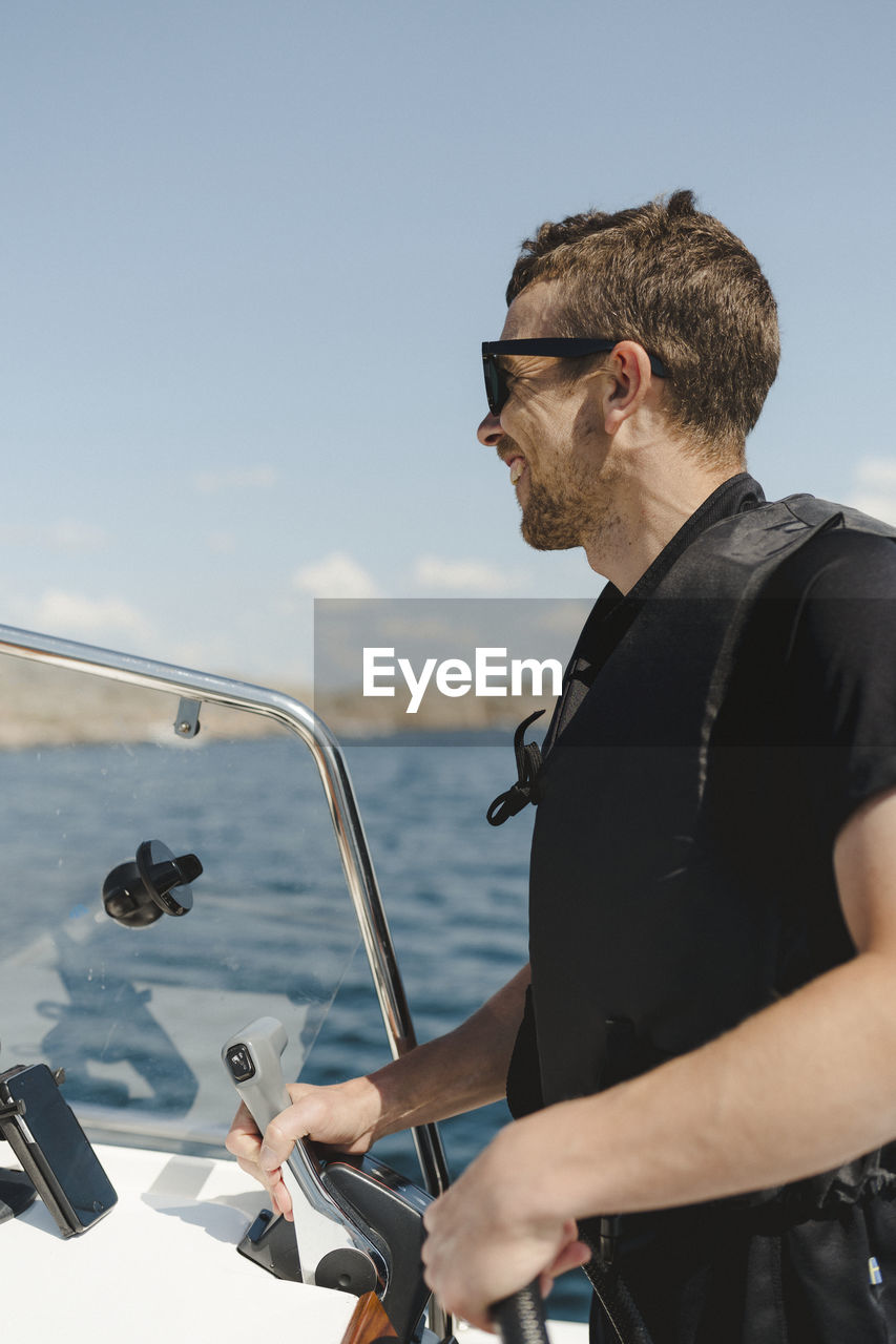 Man steering boat