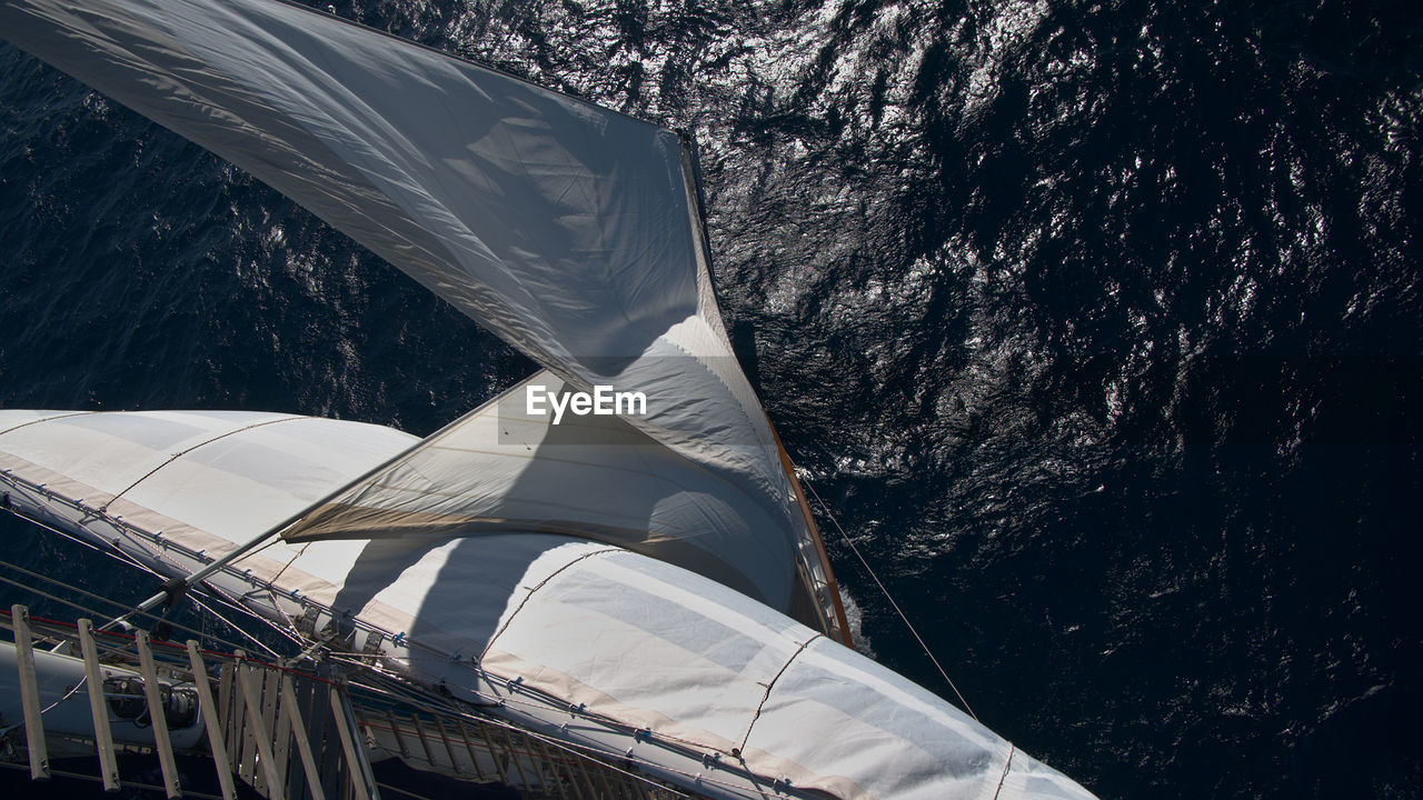 High angle view of abandoned sailboat against trees