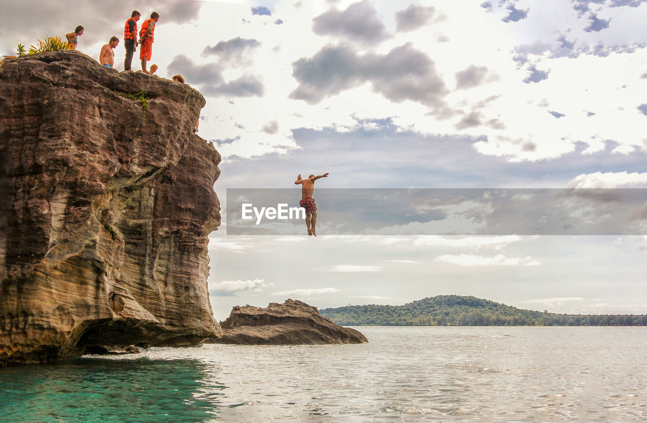 TOURISTS SWIMMING IN SEA