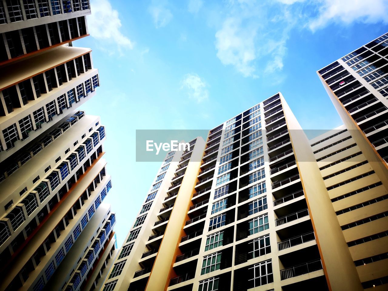 architecture, building exterior, built structure, city, building, office building exterior, sky, skyscraper, urban area, metropolitan area, tower block, metropolis, office, downtown, cityscape, low angle view, residential district, window, business, condominium, cloud, nature, apartment, no people, neighbourhood, city life, finance, landmark, tower, sunlight, outdoors, urban skyline, facade, development, construction industry, downtown district, day, corporate business, blue