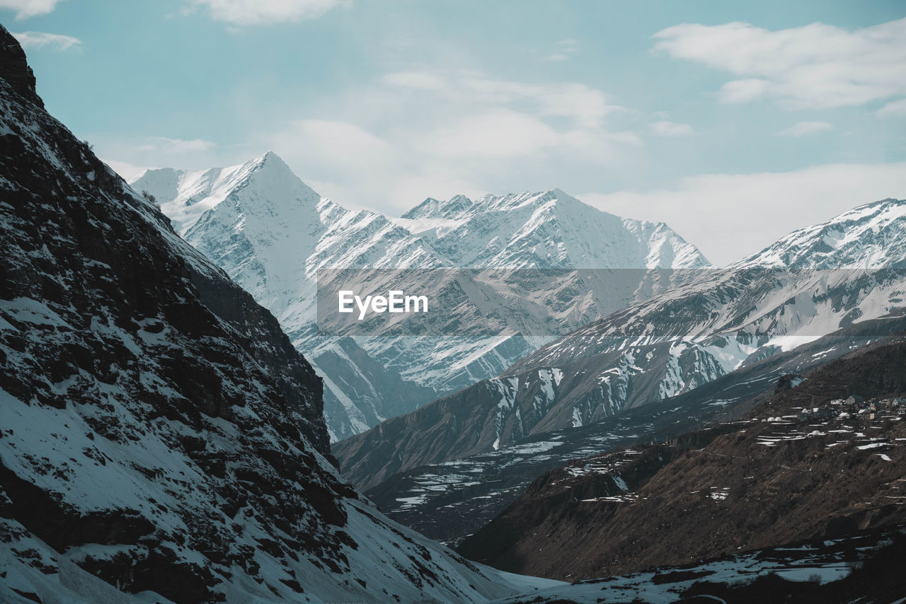 Scenic view of snowcapped mountains against sky