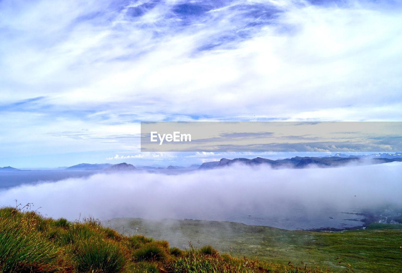 SCENIC VIEW OF FOGGY WEATHER AGAINST SKY