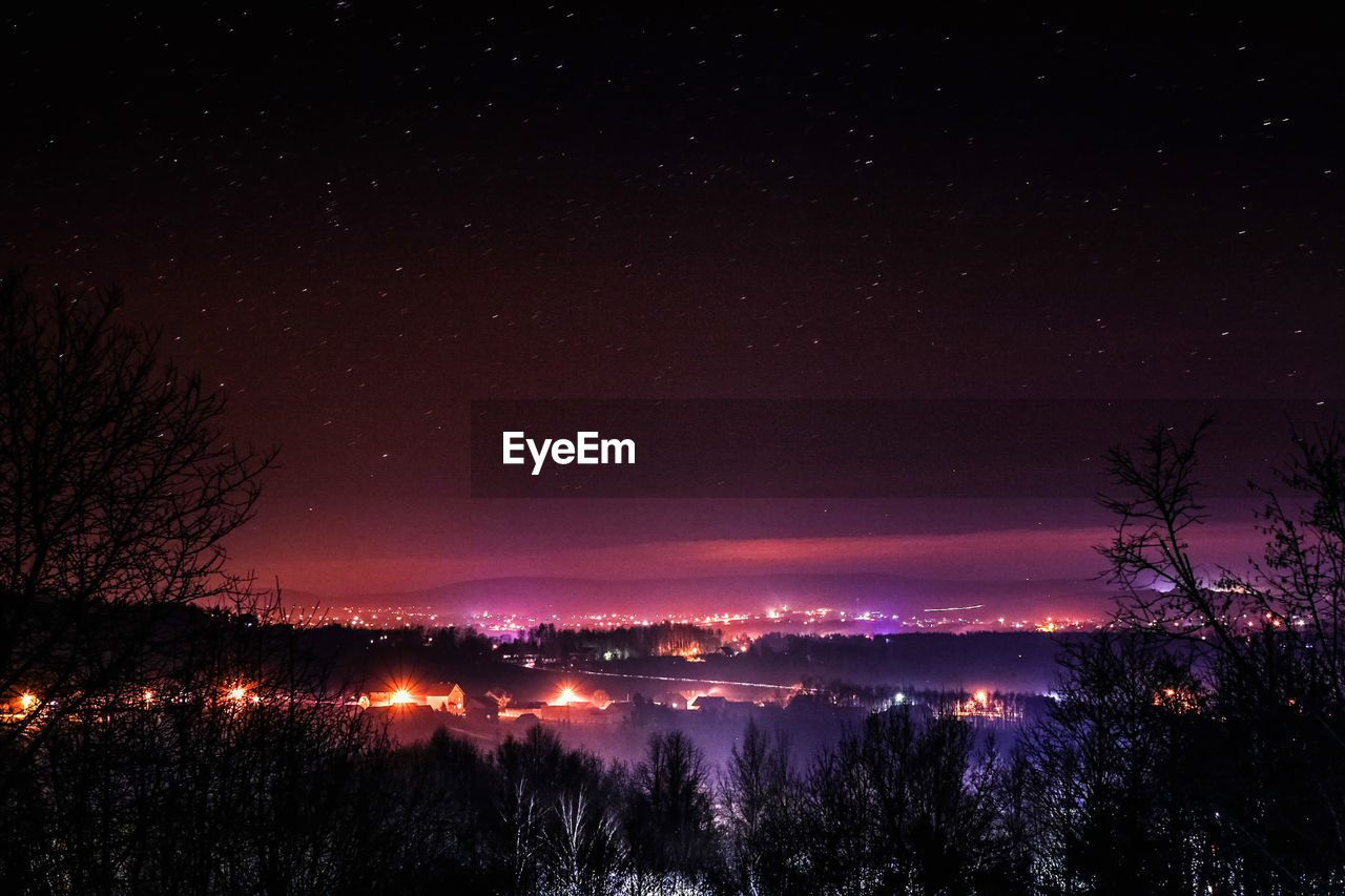 SCENIC VIEW OF SILHOUETTE TREES AGAINST SKY AT NIGHT
