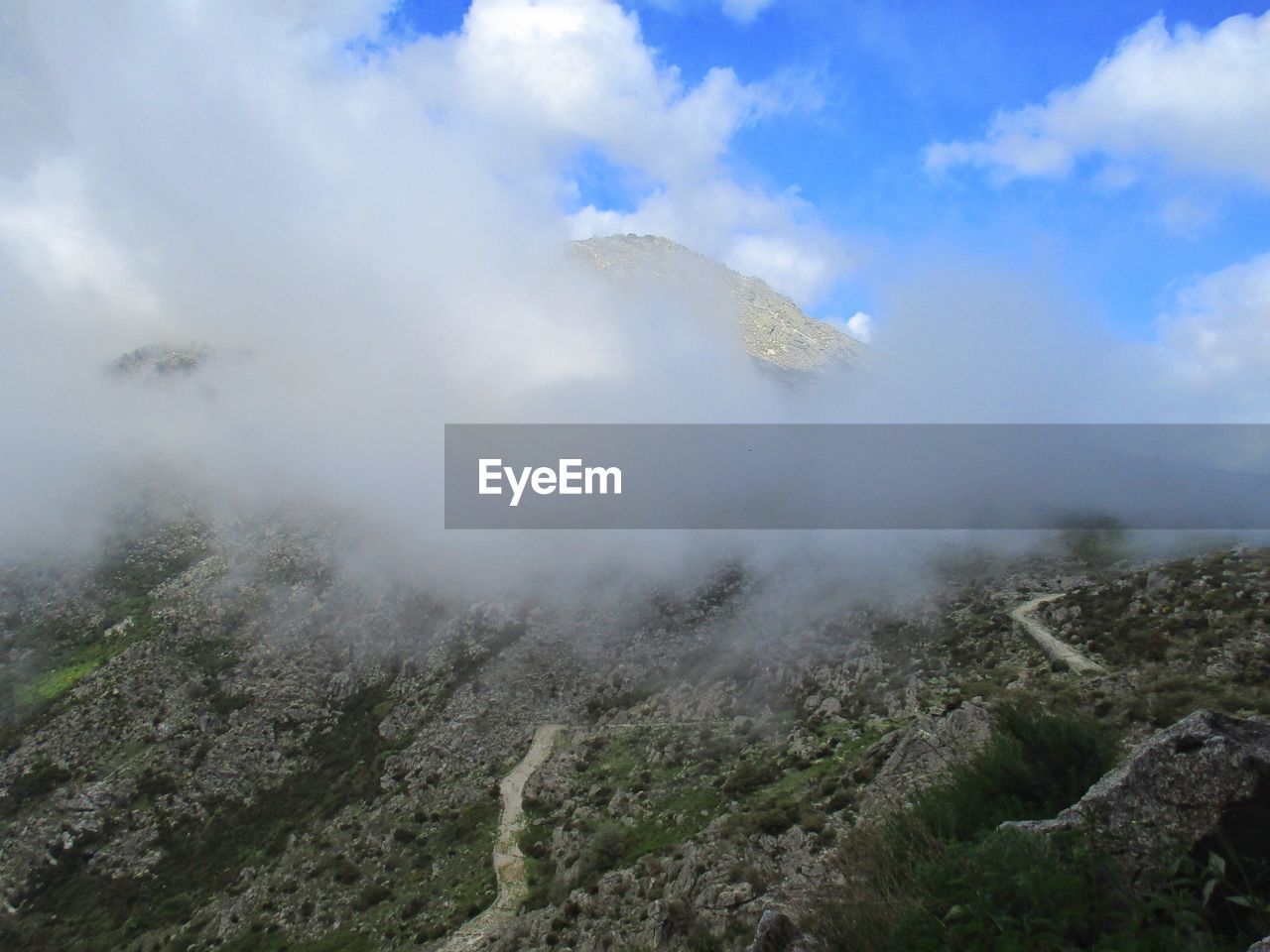 Scenic view of volcanic mountain against sky