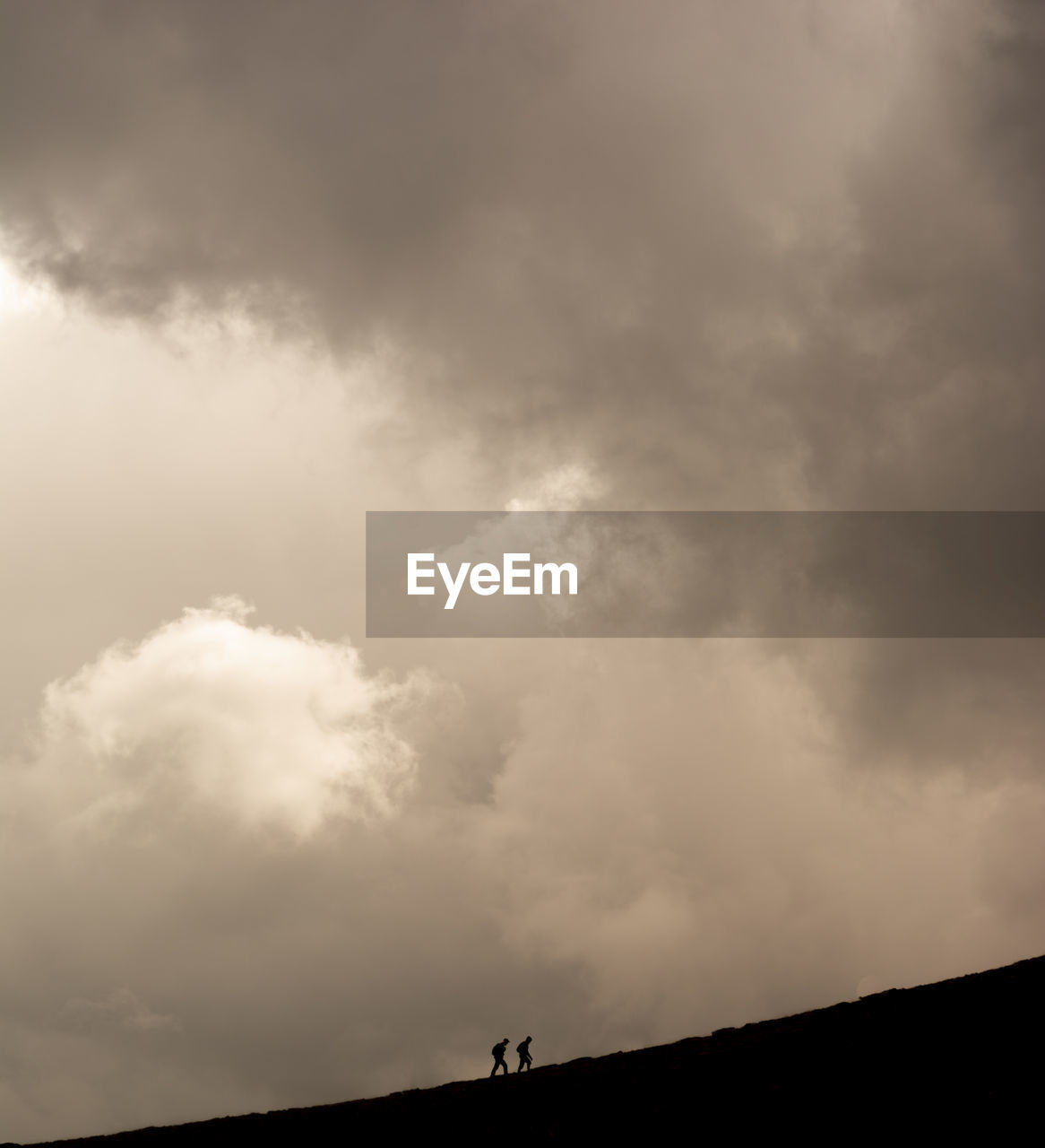 Low angle view of silhouette landscape against sky