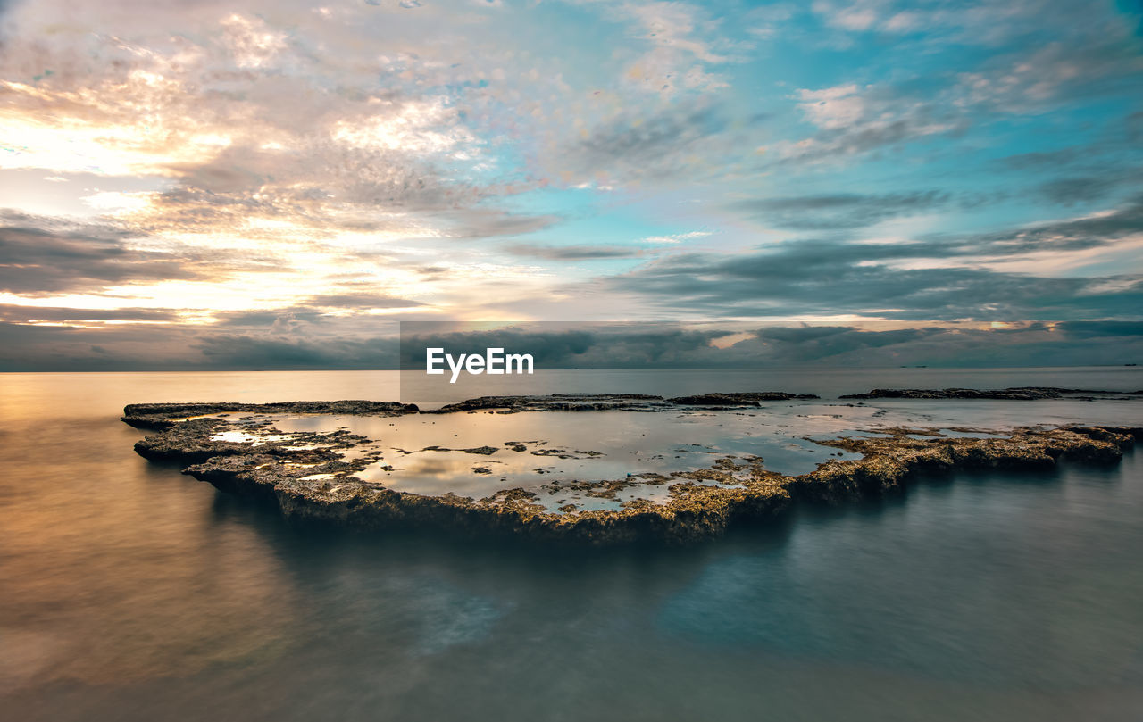 Scenic view of sea against sky during sunset