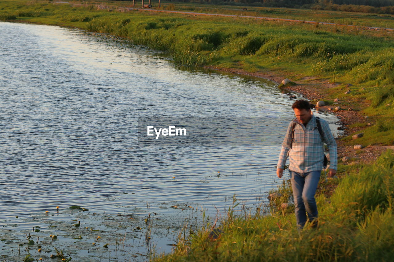 Full length of man standing on shore