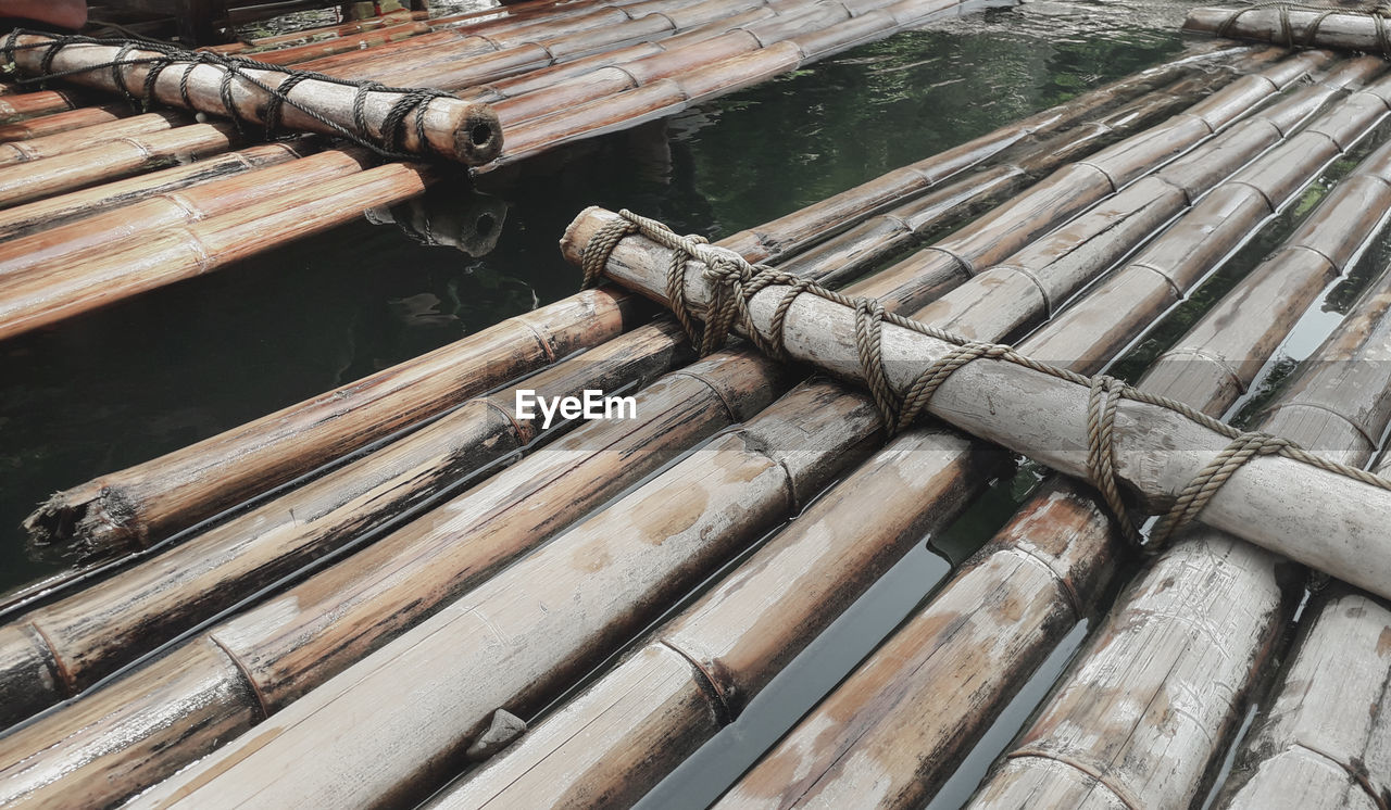 High angle view of wooden raft in lake