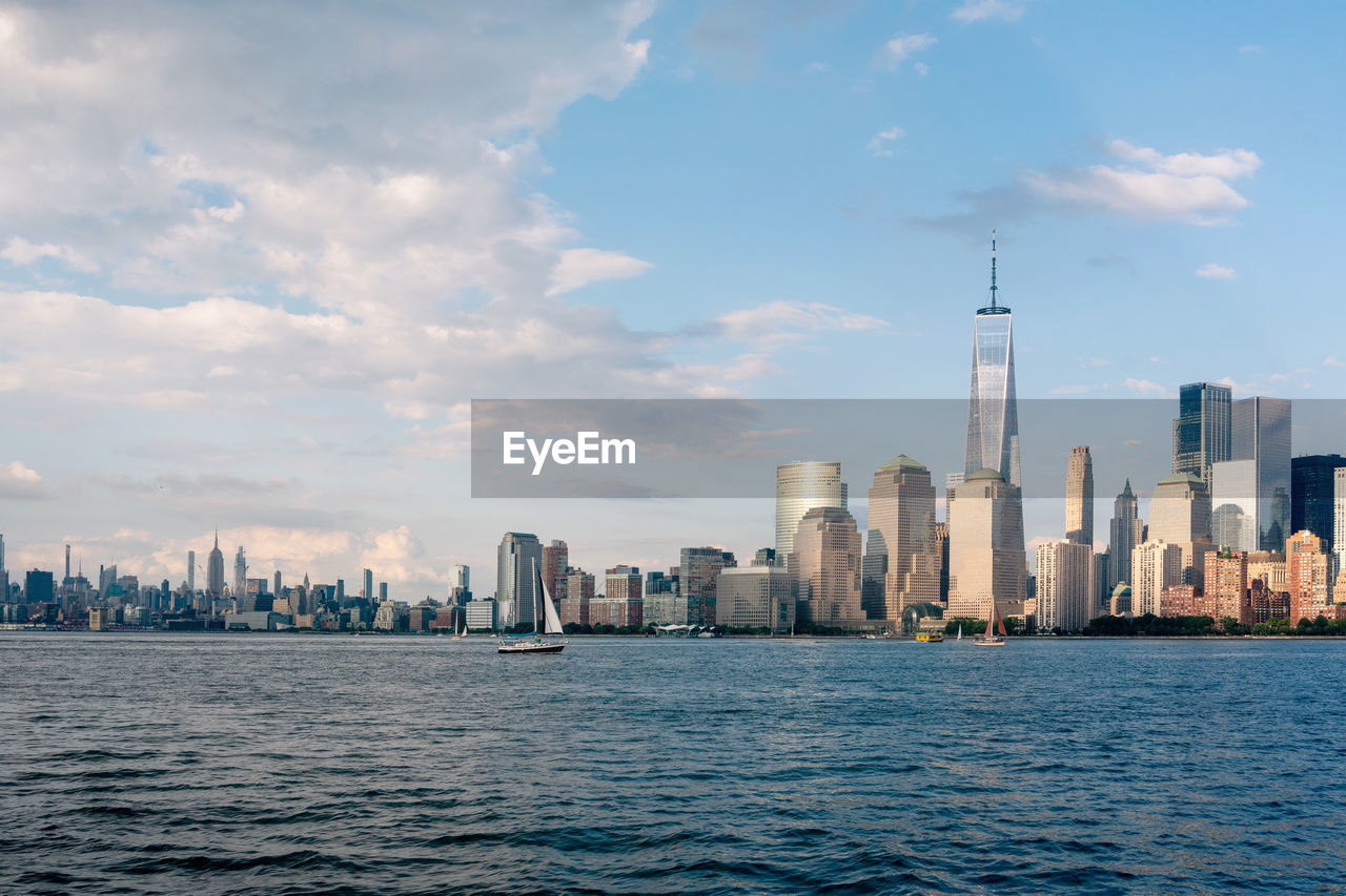 View of manhattan island from jersey city with freedom tower and empire state building in view