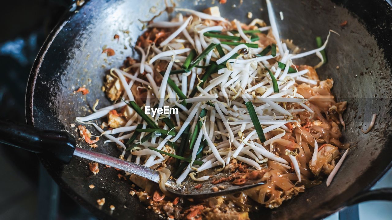 High angle view of meat in cooking pan.pad thai