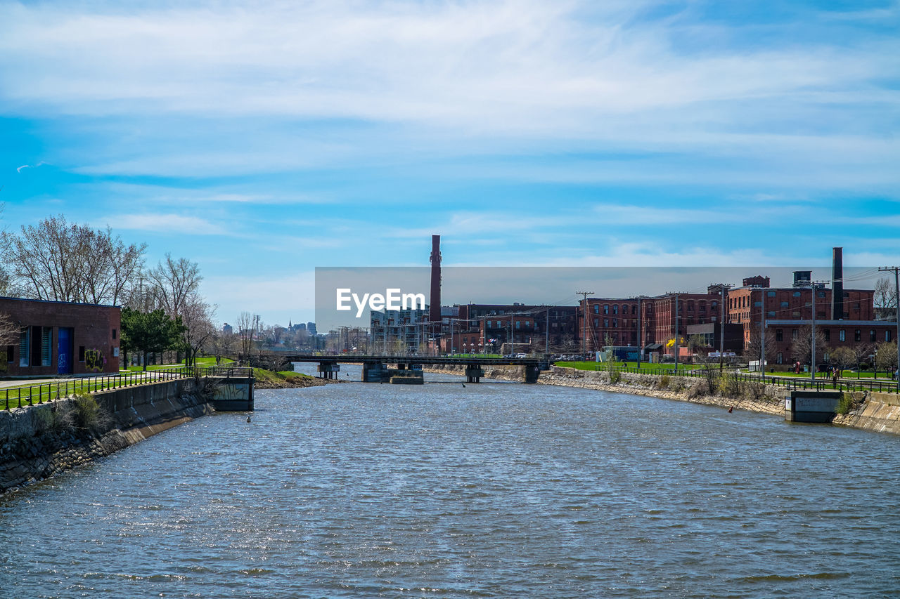 VIEW OF RIVER ALONG BUILDINGS