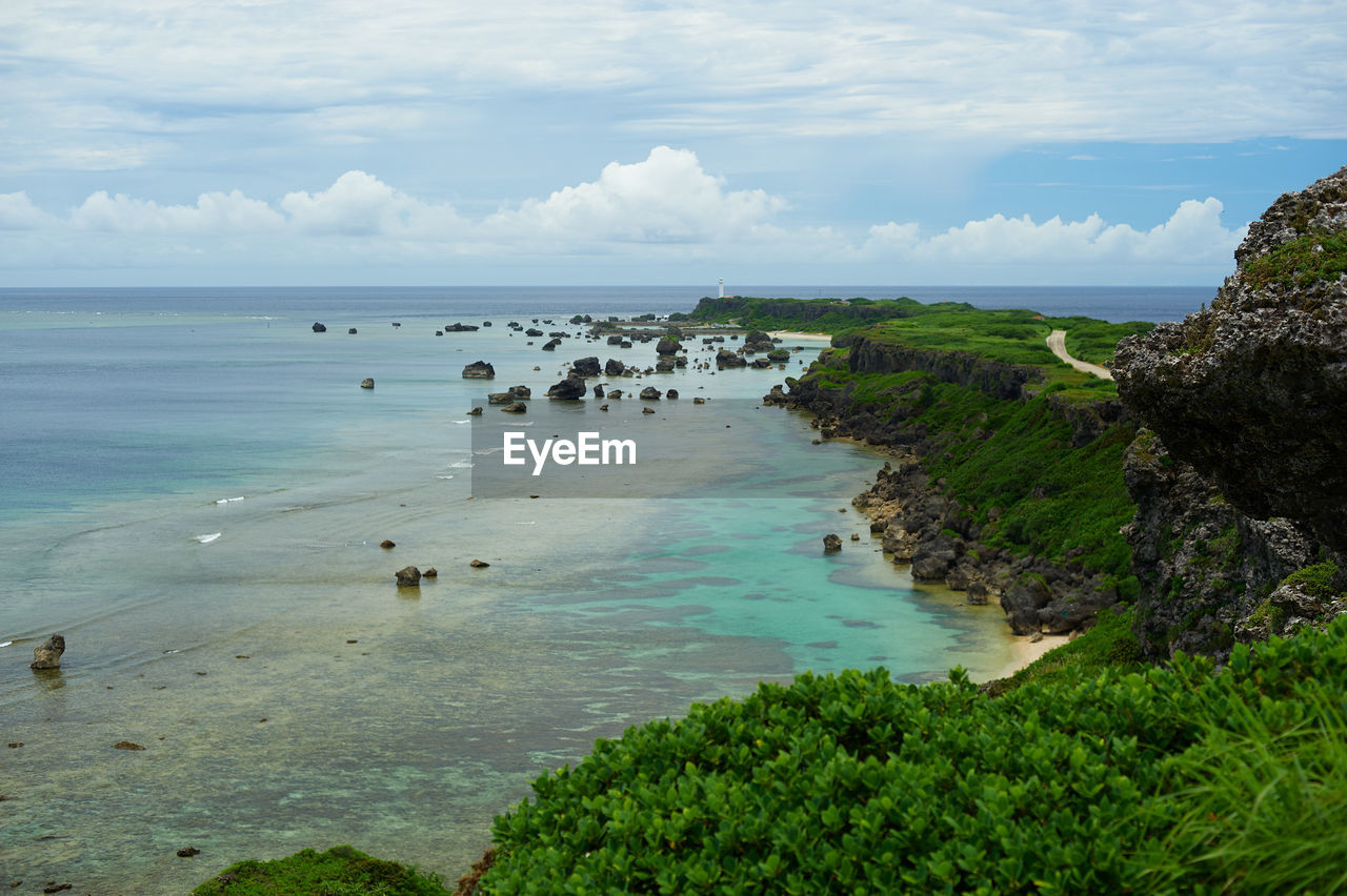 water, sea, land, body of water, beach, sky, shore, coast, scenics - nature, beauty in nature, nature, ocean, cloud, travel destinations, coastline, environment, horizon over water, travel, bay, cove, tranquility, tourism, cliff, horizon, landscape, tranquil scene, rock, trip, plant, vacation, terrain, holiday, animal, day, outdoors, animal wildlife, idyllic, island, non-urban scene, animal themes, seascape, no people, lagoon, tropical climate, blue, sand, bay of water, summer, tree