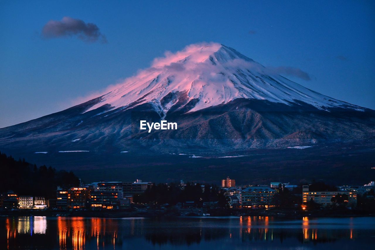 scenic view of snowcapped mountains against sky at sunset