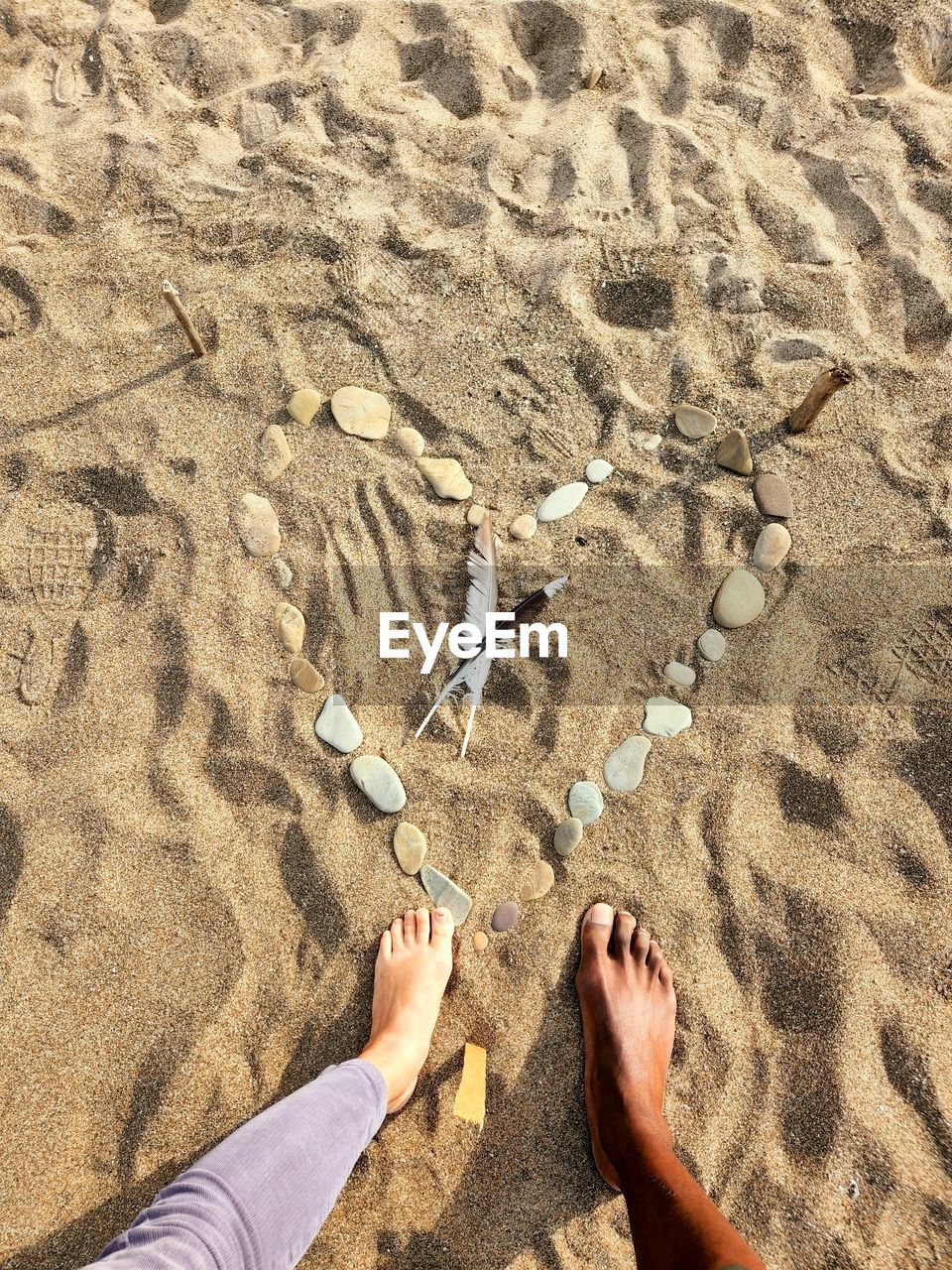 sand, beach, land, human leg, low section, high angle view, leisure activity, nature, barefoot, lifestyles, sunlight, day, one person, personal perspective, vacation, trip, holiday, human foot, footprint, soil, sea, water, outdoors, standing, adult, women, men, shoe, human limb