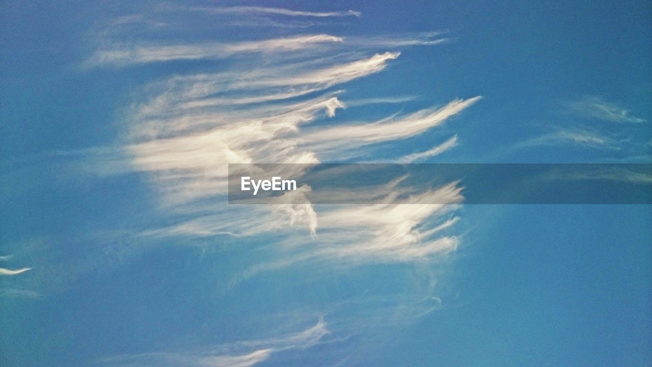 Low angle view of wispy in sky