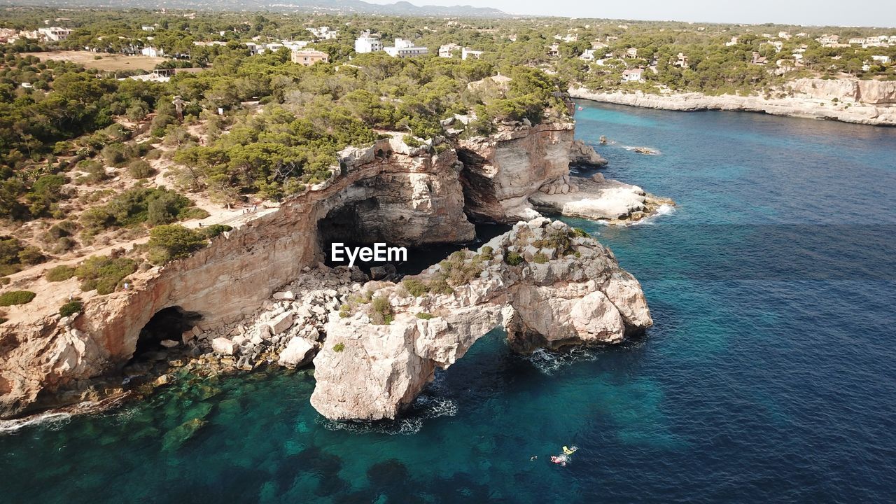 High angle view of rocks on sea