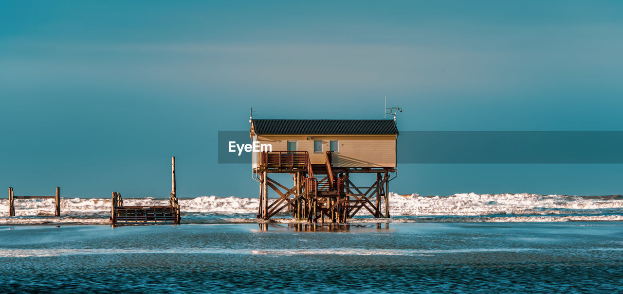 Pile dwelling on the beach of sankt peter-ording in germany.