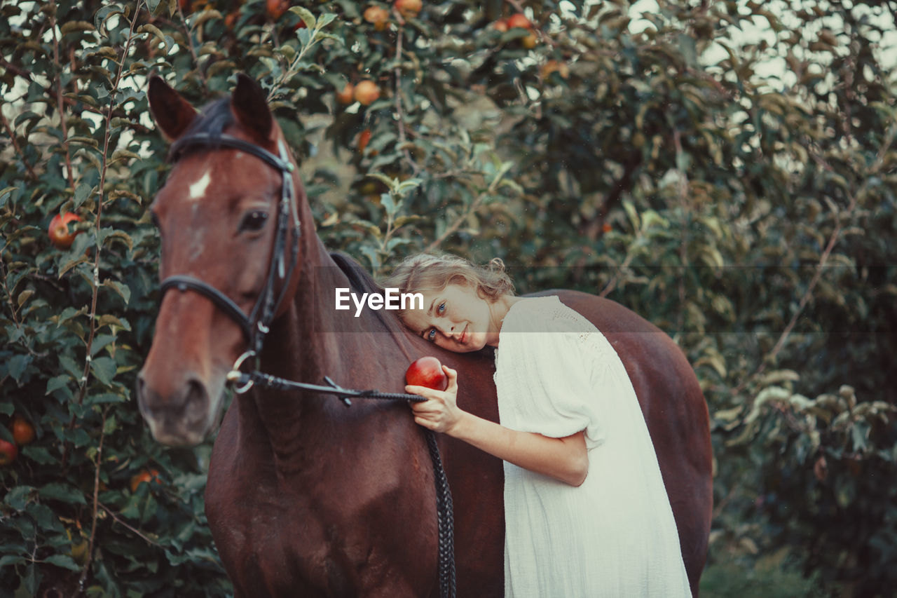 Portrait of a girl with horse