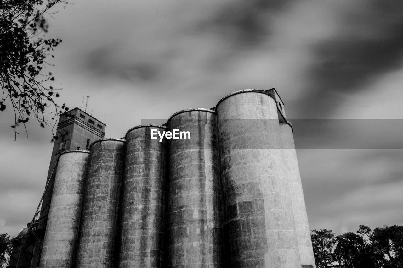 Low angle view of smoke stack against sky