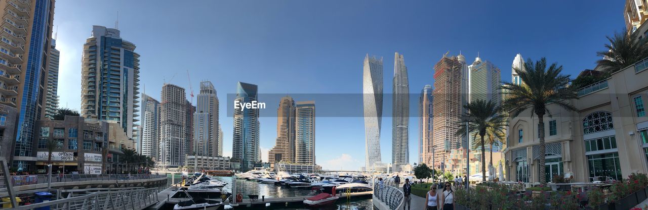 PANORAMIC VIEW OF CITY BUILDINGS AGAINST SKY