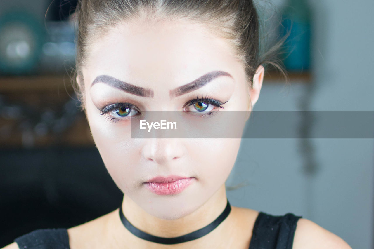 CLOSE-UP PORTRAIT OF YOUNG WOMAN WITH EYES CLOSED