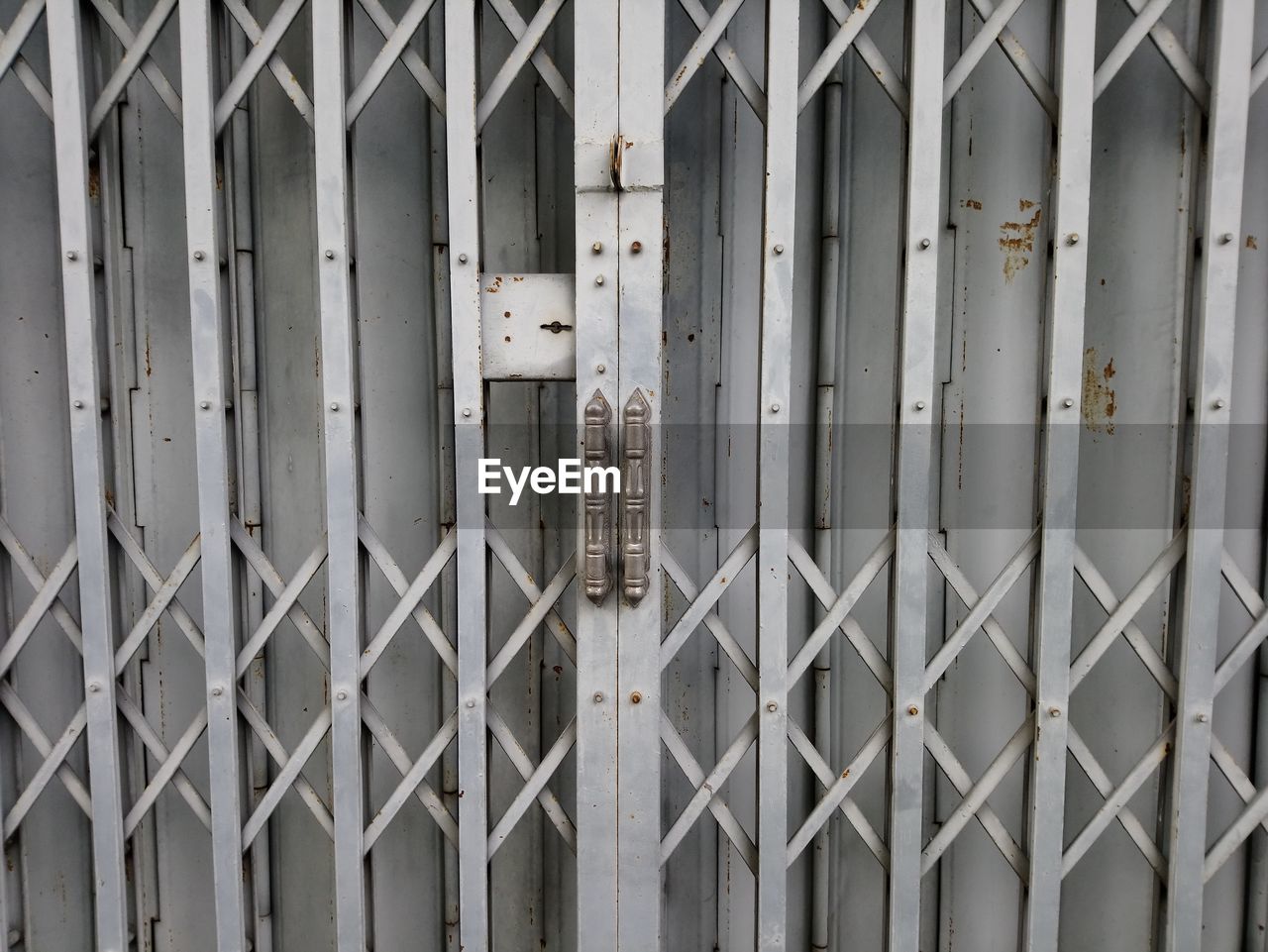 Full frame shot of closed metal gate