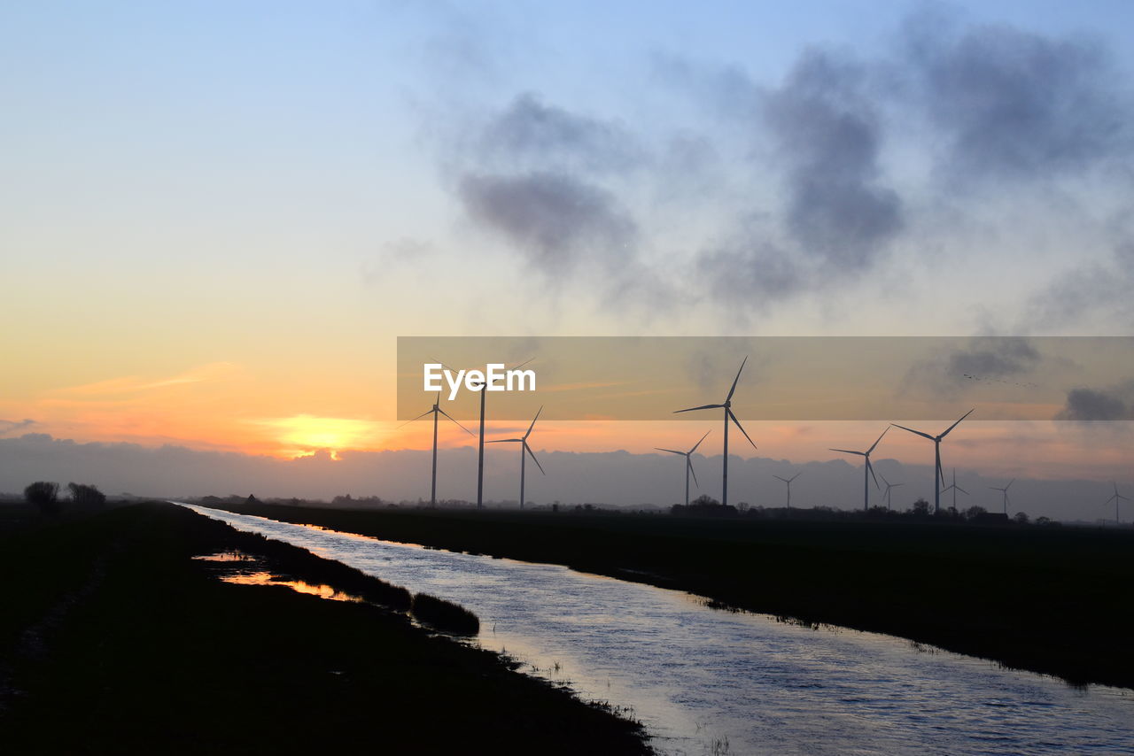 WIND TURBINES AT SUNSET