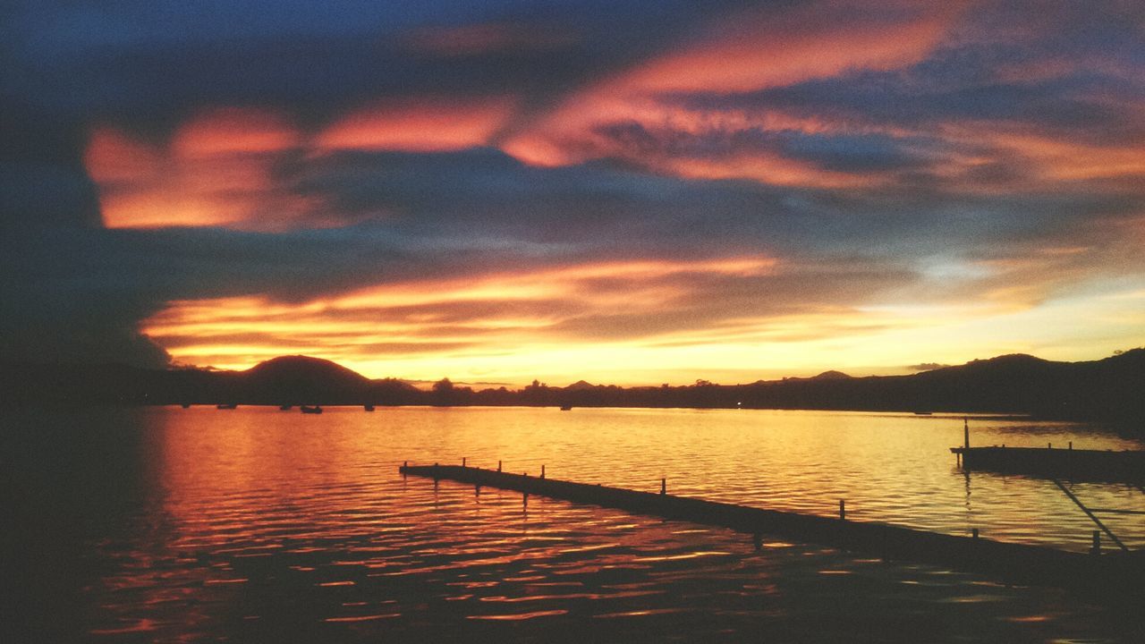 View of calm lake at sunset