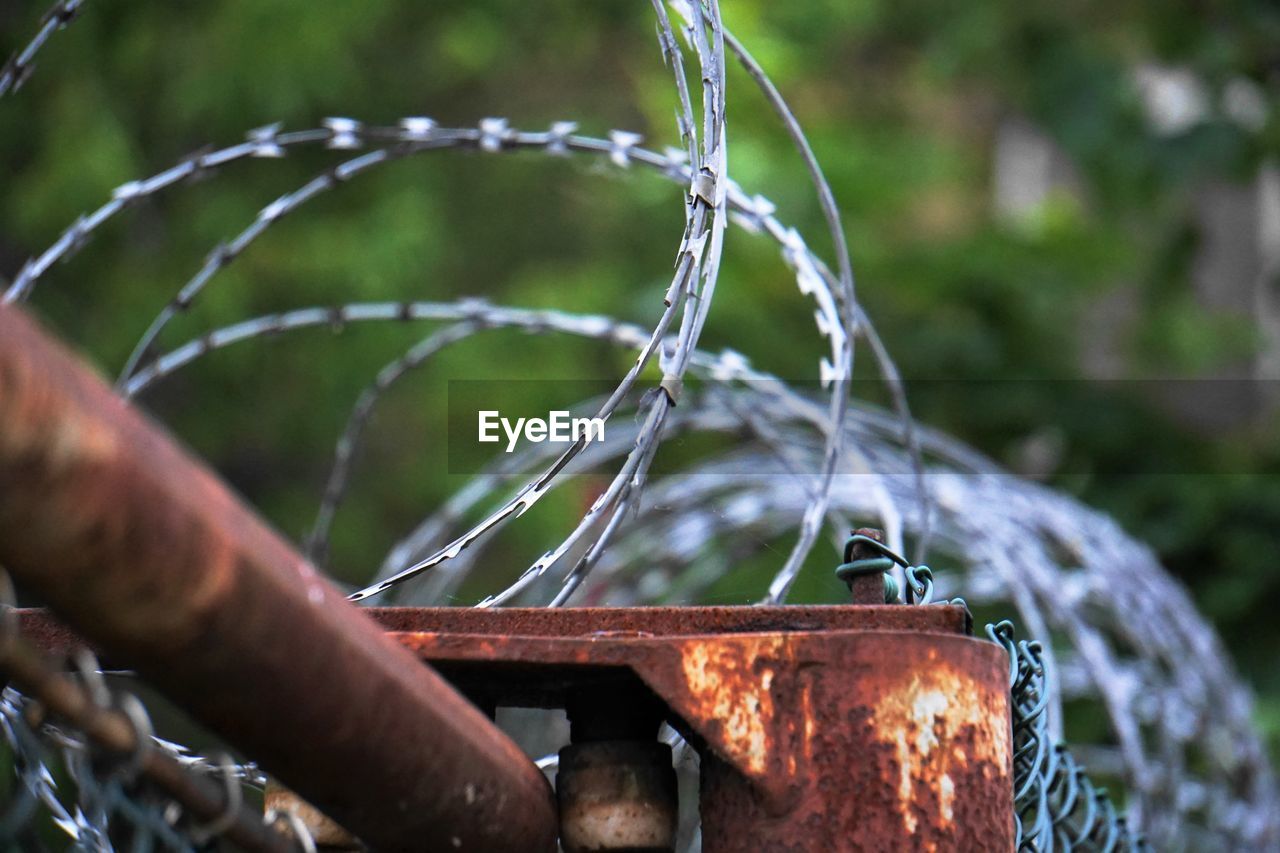 Close-up of barbed wire fence