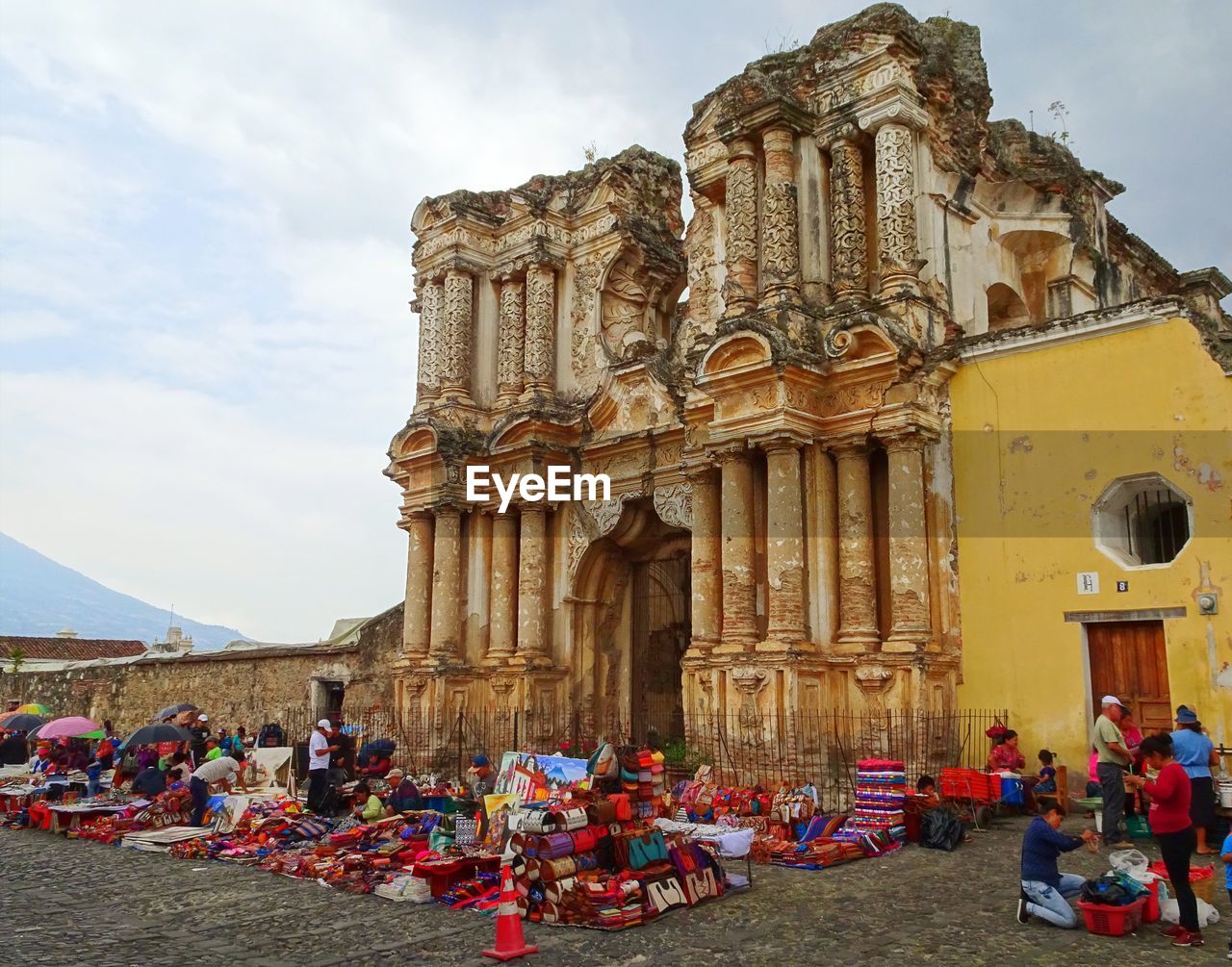 GROUP OF PEOPLE IN FRONT OF BUILDING