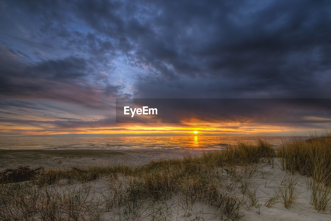 SCENIC VIEW OF SUNSET OVER LAND