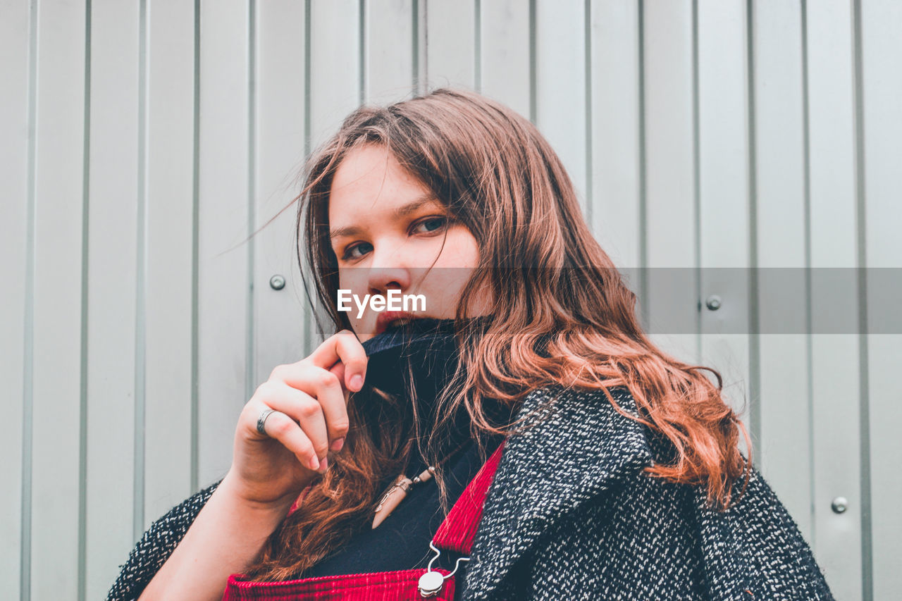 Portrait of a beautiful young woman looking away