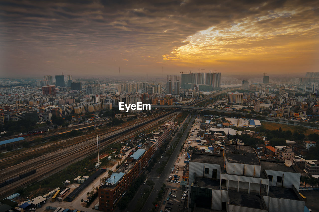 High angle view of buildings against sky during sunset