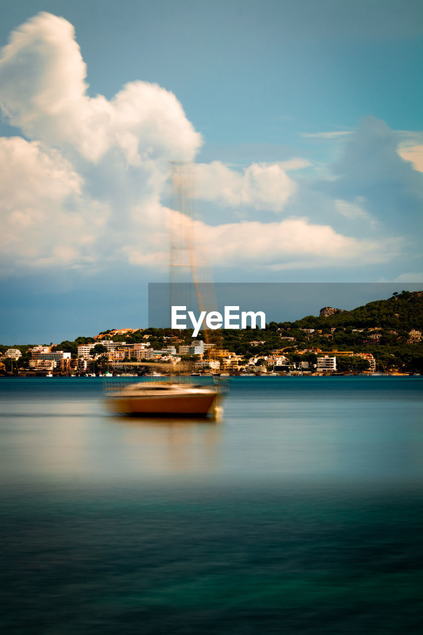 SCENIC VIEW OF SEA AND BAY AGAINST SKY