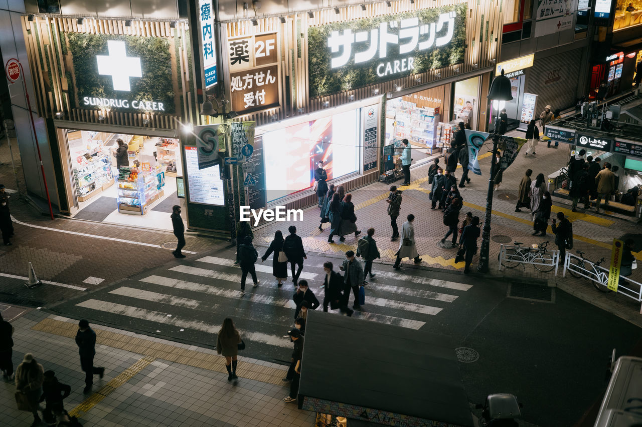 A crosswalk in shibuya as seen from above.