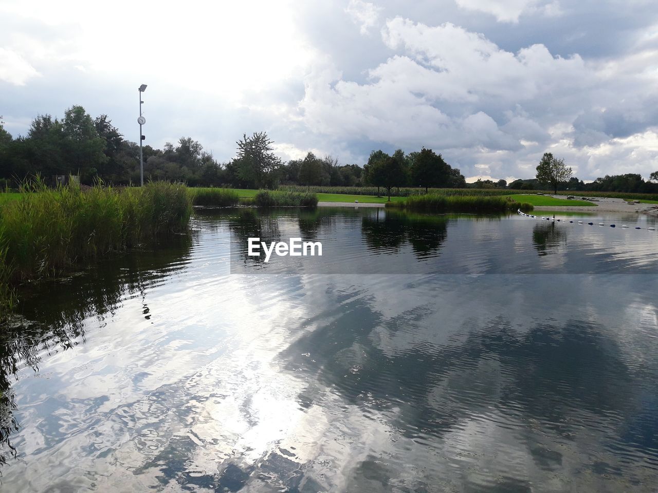 REFLECTION OF CLOUDS IN LAKE