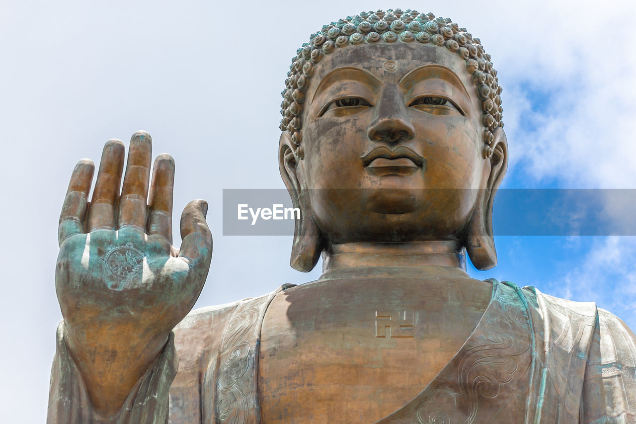 Low angle view of statue against sky