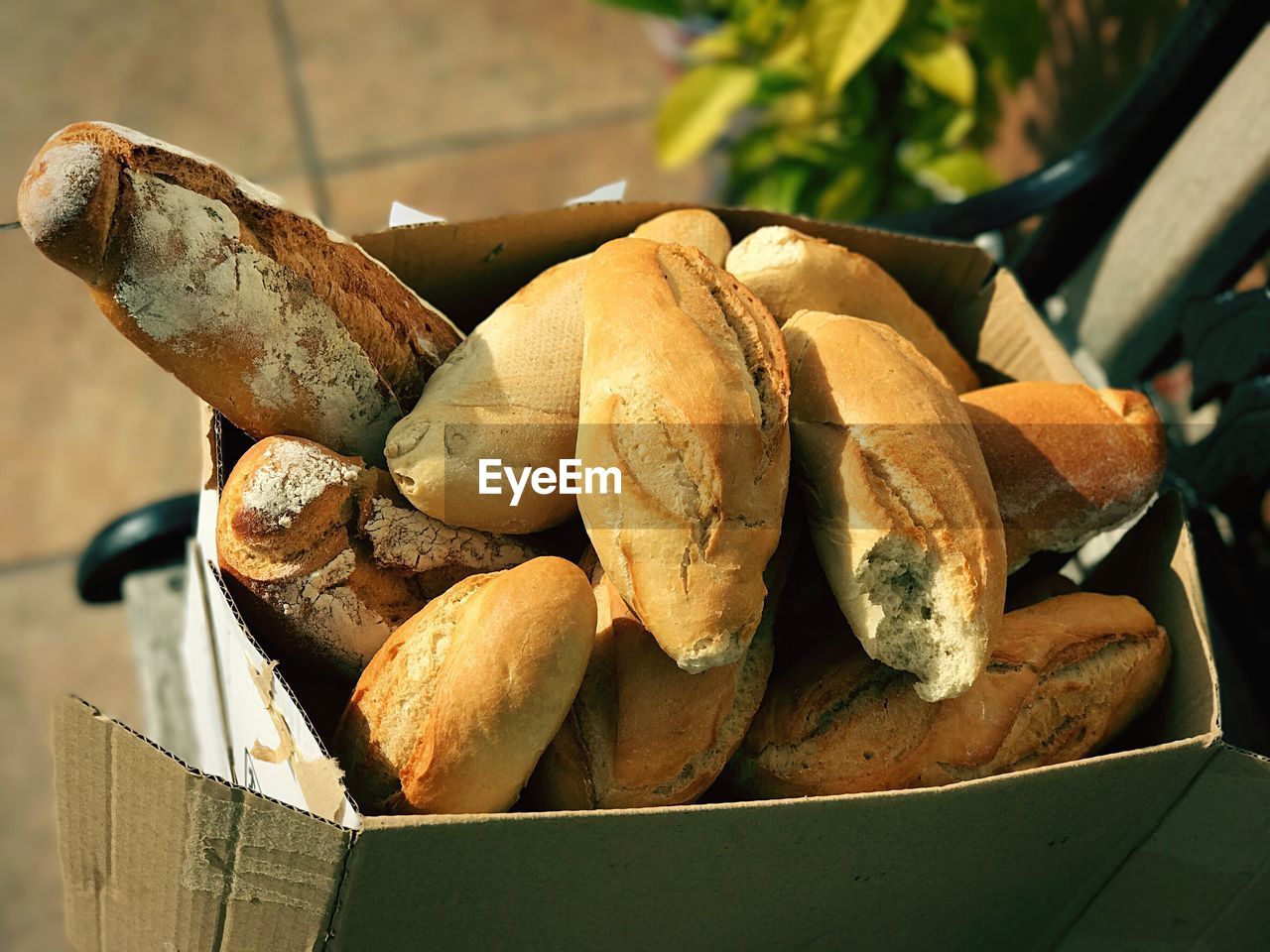 High angle view of bread in paper bag on table