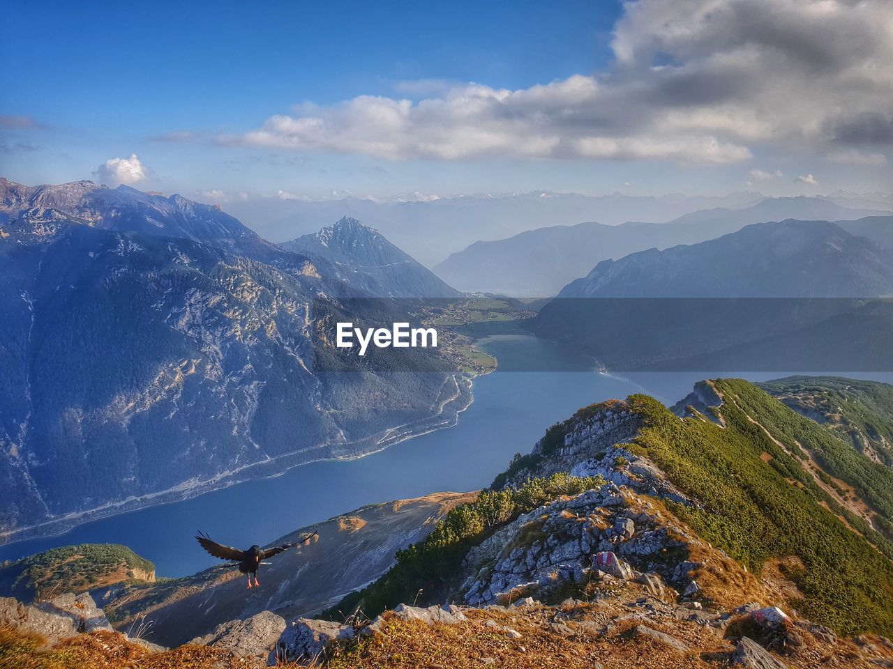 Aerial view of mountain range against sky