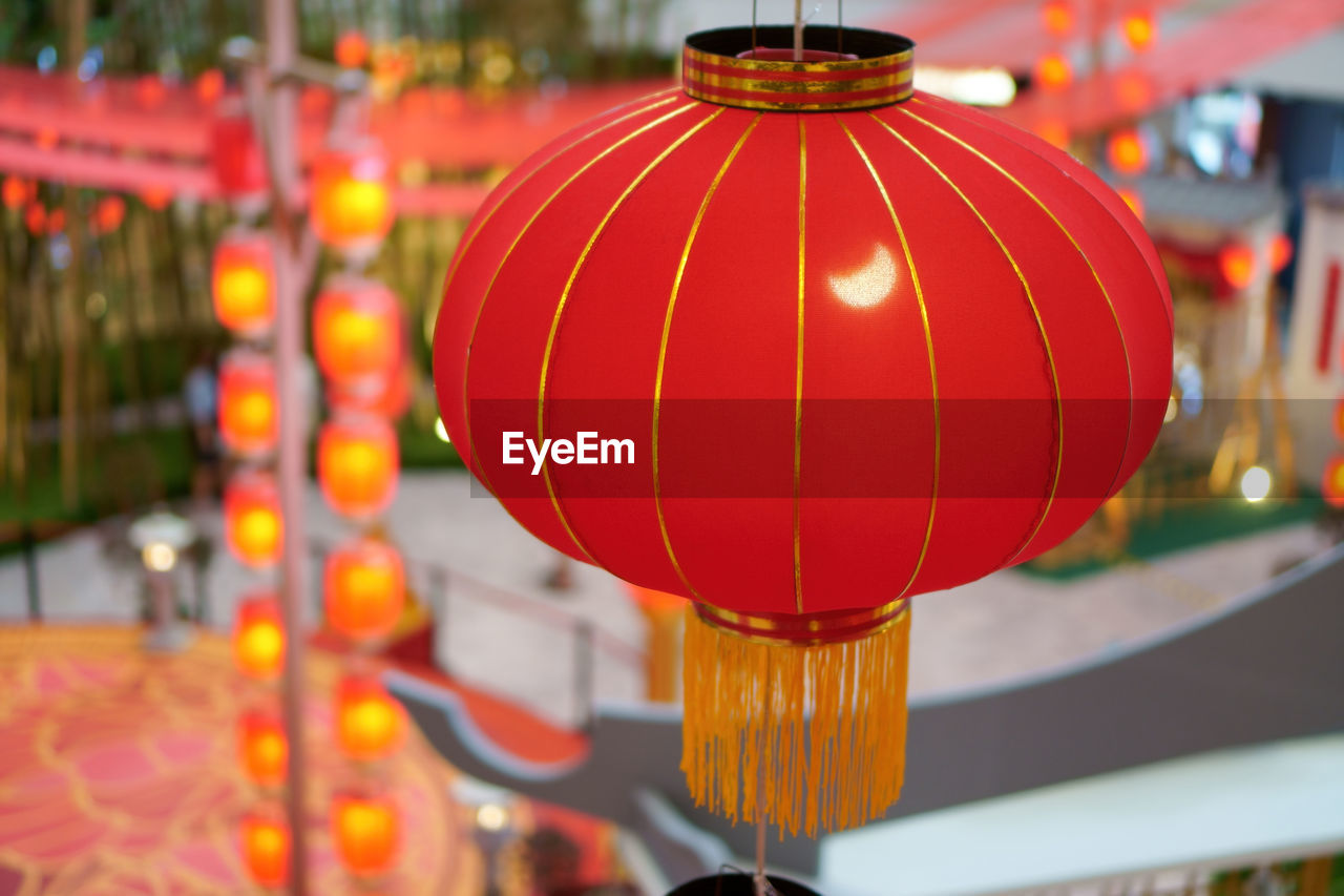 lantern, lighting equipment, chinese lantern, hanging, chinese new year, chinese lantern festival, focus on foreground, festival, celebration, decoration, tradition, red, event, illuminated, no people, holiday, traditional festival, outdoors, architecture, close-up, flower, yellow