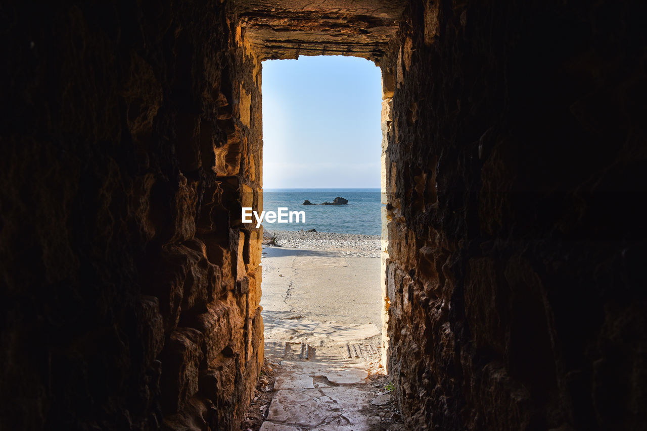 Sea view through ancient tunnel. cyprus island