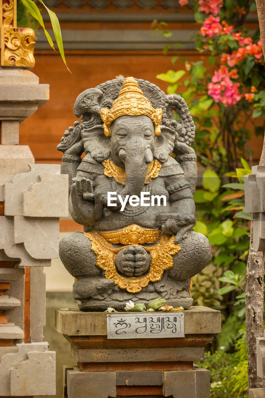 Close-up of ganesha statue against temple