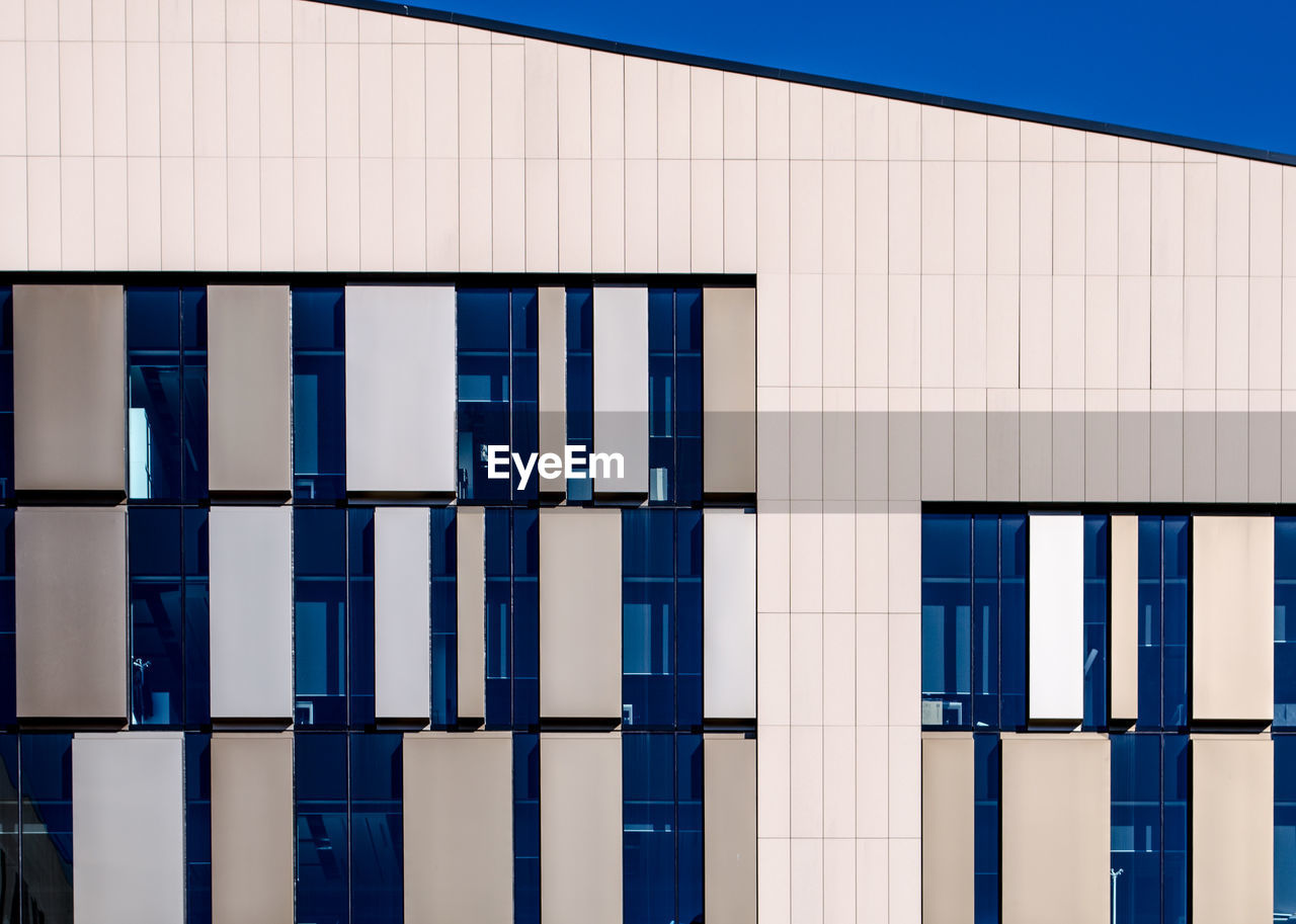 FULL FRAME SHOT OF BUILDING WITH BLUE WALL