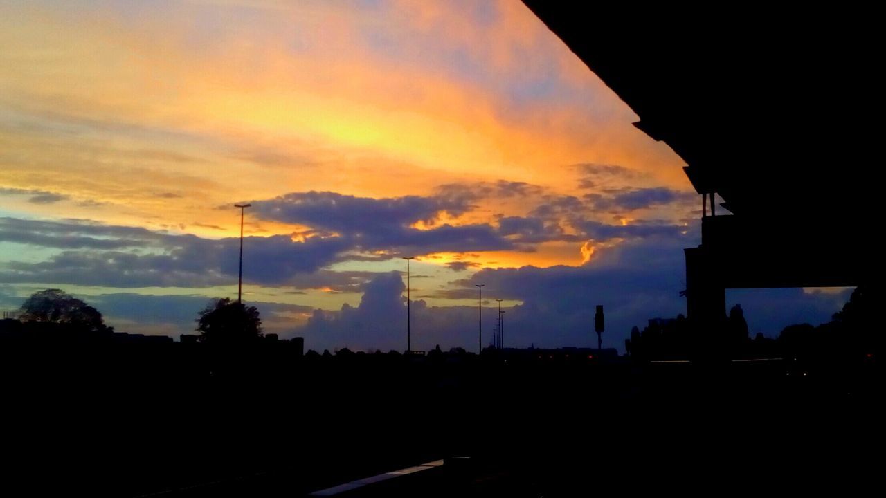 SILHOUETTE LANDSCAPE AGAINST DRAMATIC SKY