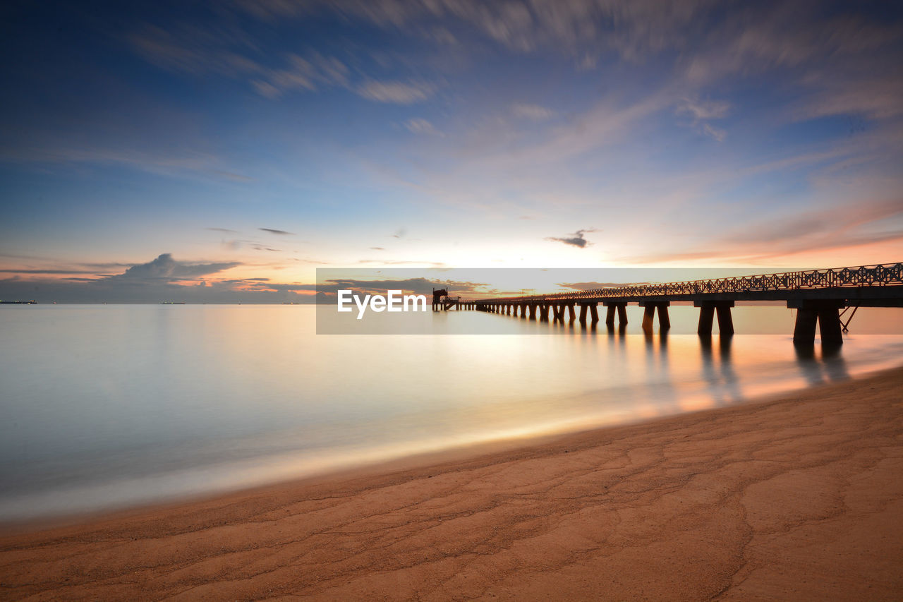 Scenic view of sea against sky at sunset