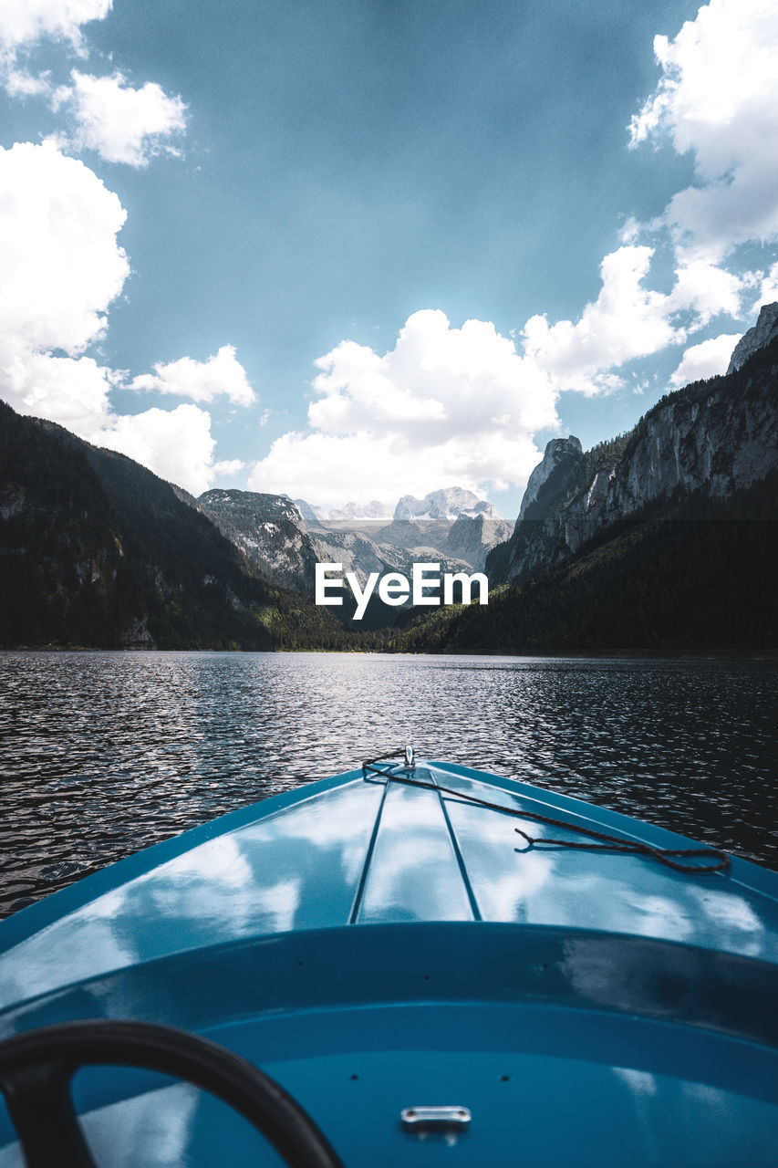 SCENIC VIEW OF MOUNTAINS AND SKY SEEN THROUGH CAR