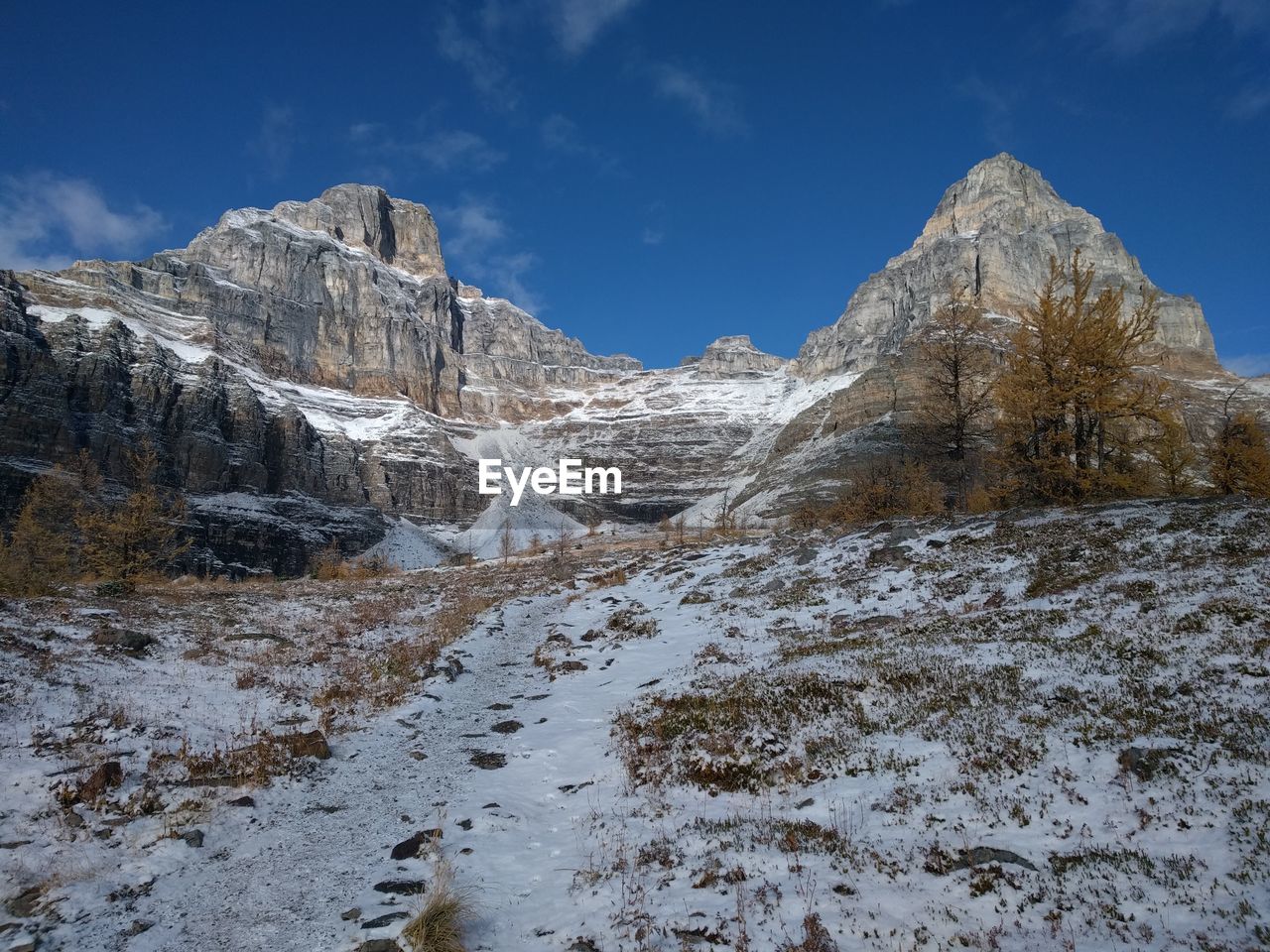 Scenic view of snow mountains against sky